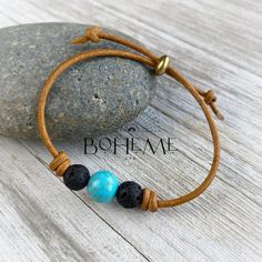 What a great gift for a loved one or maybe a little something for yourself! This rustic, minimalist bracelet has a 10mm turquoise howlite bead with smaller lava beads on each side, hand knotted on genuine leather with an adjustable bead. The lava beads are a great opportunity for essential oils. This bracelet makes a great addition to your stacked/layering bracelet collection. Each bracelet is individually hand made and quickly ships from Florida just for you.  Color of leather in photos is Clas Bohemian Lava Stone Beaded Bracelets Gift, Lava Stone Bracelets With 8mm Beads, Casual Hand-strung Beaded Bracelets With Lava Stone, Adjustable Hand-strung Lava Stone Bracelet, Black Hand-strung Lava Stone Beaded Bracelets, Beaded Leather Bracelet, Turquoise Howlite, Lava Bead, Unisex Bracelets