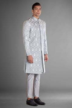 Grey sherwani crafted in silk linen with floral embroidery all over.
Components: 1
Pattern: Embroidery
Type Of Work: Floral
Neckline: Mandarin Collar
Sleeve Type: Full
Fabric: Silk Linen
Color: Grey
Other Details: 
Concealed placket
Note: The inner kurta, trouser and dhoti pant worn by the model are not for sale
Occasion: Destination Wedding - Aza Fashions Silk Sherwani With Embroidery For Reception, Silk Sherwani With Naqshi For Diwali, Long Sleeve Silk Sherwani For Reception, Designer Silk Sherwani With Embroidery, Formal Silk Sherwani With Traditional Drape, Silk Sherwani With Resham Embroidery For Reception, Designer Embroidered Silk Sherwani, Silk Sherwani With Naqshi Long Sleeve, Silk Sherwani With Naqshi Detailing