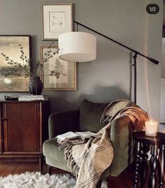 a living room filled with furniture and a lamp