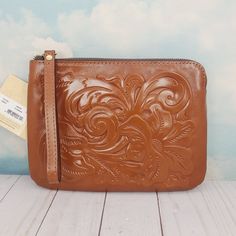 New Patricia Nash Cassini Wristlet Tooled Leather Color: Florence Handmade Heavy Handcrafted Stitching Antique Brass Hardware Burned Edge Finish Zip Top Closure Inside: 1 Zip Pocket 2 Slip Pockets Velvety Faux Suede Lining Approx 9"L X 6 3/4"H X 1/2"D Nwt New With Tag Guaranteed Authentic Brown Clutch Pouch With Wrist Strap, Brown Leather Clutch With Wrist Strap, Brown Pouch With Wrist Strap For Daily Use, Brown Clutch With Wrist Strap For Daily Use, Brown Wristlet For Everyday Use, Leather Brown Wristlet, Brown Leather Clutch Wristlet, Brown Leather Wristlet With Removable Pouch, Brown Wristlet With Removable Pouch