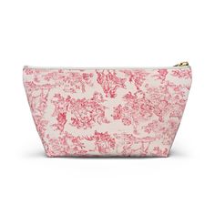 a pink and white floral print cosmetic bag on a white background with gold zipper closure