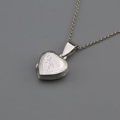 Minimalist Heart Locket Engraved Leaf Design Silver Necklace Jewelry CODE: PNK51 Metal: 925 Sterling Silver Locket size: 15mm W x 24mm H Chain Length: 16 Inch, 18 Inch Chain Extension: 1.5 Inch Finishing: Silver Weight: 2.50 Gram Price Per Piece This beautiful 925 Sterling Silver Heart Locket Necklace would be a perfect gift for that special someone in your life Buy this necklace for your loved one or friends, and know that without a doubt you have purchased the perfect present for the any occas Elegant Etched Heart Pendant Jewelry, Silver Etched Necklace For Valentine's Day, Valentine's Day Silver Etched Necklace, Silver Heart-shaped Etched Jewelry, Silver Heart-shaped Etched Necklace, Classic Double Heart Engraved Jewelry, Dainty Sterling Silver Locket Necklace For Anniversary, Dainty Heart-shaped Sterling Silver Locket Necklace, Etched Heart Silver Jewelry