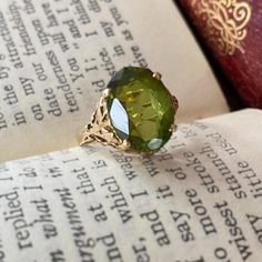 Gorgeous vintage ring in really excellent condition. A really special piece featuring a large peridot stone in beautiful condition.  Very comfortable and easy to wear. It would make a wonderful gift!   delivered in a gift box.  Solid 14k yellow gold Peridot Size O Gold Peridot Ring, Peridot Stone, Peridot Ring, Vintage Ring, Stackable Rings, Vintage Rings, Jewelry Rings, Gift Box, Yellow Gold