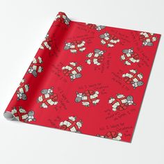 a red wrapping paper with cartoon characters and words on it, featuring santa's sleigh