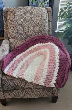 a chair with a blanket on top of it