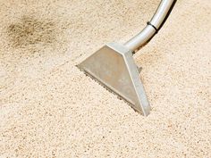 a close up of a vacuum on the floor with dirt all over it's surface