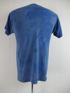 "Vintage 1980s t shirt. Made of blue tie dye style poly/cotton with yellow and white graphics: Canadian Club fun in the sun. Made by Screen Stars. Size medium. Actual measurements are: 37\" around the chest 37\" around the waist 17\" shoulder seam to shoulder seam 27\" overall length In good condition with a couple 1\" spots(photos)." Vintage Faded T-shirt Pre-washed, Vintage Pre-washed T-shirt For Summer, Vintage Acid Wash Pre-washed T-shirt, Faded Pre-washed T-shirt For Summer, Fitted Acid Wash T-shirt, Fitted Acid Wash Short Sleeve T-shirt, Vintage Acid Wash T-shirt, Vintage Pre-washed Cotton T-shirt, Vintage Bleached Tops For Summer