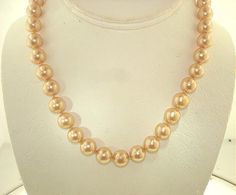 THIS IS A CUSTOM MADE TO ORDER LISTING FOR THIS EXACT LENGTH DESIGN WITH SAME GOLD COLOR PEARLS OR CHOICE OF MANY OTHER PEARL COLORS AVAILABLE THAT WILL TAKE APPROX. 3-5 DAYS TO CREATE BEFORE SHIPPING. AS THESE ARE CUSTOM MADE HERE IN HAWAII, SHORTER OR LONGER LENGTHS ARE ALSO AVAILABLE BY ASKING SELLER FOR A QUOTE. Brand New, Never Used Single-Strand Sea Shell Pearl Necklace. 100% Hand-Made South Sea Golden-Lipped Oyster's Mother of Pearl Shell Single-Strand Pearls Necklace With 14k Yellow Gold-Plated Ring Clasp. - Design: South Sea Shell Pearls (South Sea Gold); Symmetrically Perfect Rounds, 14k Yellow Gold-Plated Ring Clasp, Individually Hand-Knotted Silk Thread Separations, High Polish Luster, Smooth Surface. - Measures: Pearls Average Approx. 9.9mm - 10.1mm Round (Approx. Just Over 3/ Formal Necklaces With Round High Luster Beads, Formal High Luster Round Bead Necklaces, Formal High Luster Round Beaded Necklaces, 16 Inch Round Elegant Pearl Necklace, Elegant 16 Inch Round Pearl Necklace, Elegant Formal Pearl Necklace 16 Inch, Elegant 16 Inch Pearl Necklace For Formal Occasions, High Luster Round Necklace, Classic High Luster Necklaces For Wedding