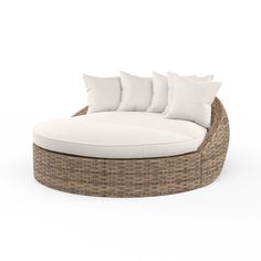 an outdoor daybed with white cushions and pillows on the top, in front of a white background