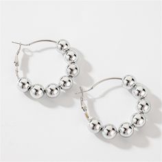 Finish off your look with these shiny beaded huggie earrings designed with a bright, versatile silver-plated finish. 1.7" diameter Silver-plated copper Beaded Hoop Earrings, Huggie Earrings, Huggies Earrings, Designer Earrings, Silver Plate, Silver Plated, Silver Bracelet, Hoop Earrings, Copper