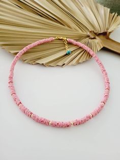 Handcrafted beaded necklace with soft clay beads and golden beads. Beads size: 5cm. Lobster claw closure.  Length of necklace: 41cm (16 inches) + extension chain. Color: marble pink. Pink Round Bead Necklaces For Vacation, Pink Round Beads Necklace For Vacation, Pink Round Beads Necklaces For Vacation, Pink Necklaces With Colorful Beads For Vacation, Pink Necklace With Colorful Beads For Vacation, Pink Heishi Beads Beaded Necklace, Pink Heishi Beads Necklace, Pink Heishi Bead Necklace With Colorful Beads, Pink Heishi Beads Necklace With Tiny Beads