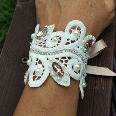 Gorgeous Lace Rhinestone Cuff Bracelet Accented With Pearls And Champagne Rhinestone Brooches. This Bracelet Measures 5.5" And Has Champagne Satin Ribbon Ties For Adjustment To Fit Most Wrists. Https://Www.Etsy.Com/Shop/Countryjourney Bracelet Corsage, Lace Cuff Bracelet, Swarovski Pearls Bracelet, Fabric Cuff Bracelet, Tahitian Pearl Bracelet, Denim Jewelry, Dragon Bracelet, Copper Cuff Bracelet, Lace Cuffs