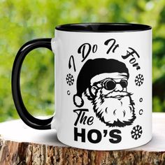 a black and white coffee mug with the words do it for the ho's on it