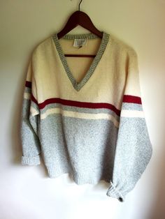 Up for sale is a vintage 1970's wool blend knit striped / colorblock v-beck sweater in an estimated size of Medium (tag size large--measurements below). Overall the garment is in good condition with no major rips or tears. There are a couple of tiny brown spots on the upper creamish part of the sweater (see photos). The sweater is primarily a light blue / gray mélange. Some pilling exists. Furnace Creek Wool / nylon Tag size: L Estimated size: M Measured flat (inches across): Length (back bottom Retro Striped Knitted Sweater, Multicolor Wool V-neck Sweater, Retro Striped Color Block Sweater, Colorblock Sweater, Brown Spots, Wool Knit, Color Block Sweater, Blue Gray, Sweater Outfits