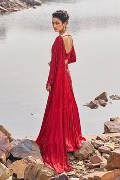 Beautiful red drape fish cut embellished sari in crepe is paired with embroidered sweetheart neck blouse in silk.The blouse is padded and have a back hook closure. Red Sequined Traditional Drape Blouse Piece, Red Unstitched Saree With Cutdana, Red Pre-draped Saree With Cutdana, Red Cutdana Pre-draped Fitted Saree, Red Semi-stitched Blouse With Cutdana, Sweetheart Neck Blouse, Fish Cut, Red Drapes, Personal Shopping Service