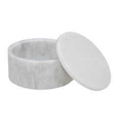 two white marble bowls sitting next to each other