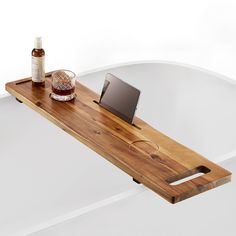 PRICES MAY VARY. Premium Acacia Wood Construction: Crafted from high-quality Acacia wood, this bathtub tray table boasts a natural and distinctive wood grain pattern, making each piece unique. Precise Dimensions: Measuring 39 inches in length, 9.75 inches in width, and 2.5 inches in height, with a tray depth of 0.9 inch, providing ample space for various items during your bath. Effortless Assembly: Equipped with two adjustable feet for quick and secure installation on your bathtub. The assembly process is simple and takes just 5 minutes, ensuring a hassle-free setup. Functional Design: Features dedicated slots for your phone and iPad, tablets along with two grooves to securely hold wine glasses or your favorite beverages, adding a touch of luxury to your bathing ritual. Spa-Like Experience Bath Book Holder, Tub Caddy Wooden, Master Tub Decor, Bathtub Organization Ideas, Freestanding Bathtub Decor, Garden Tub Decor Master Bath, Soaking Tub Decor, Exotic Bathrooms, Large Bath Tub