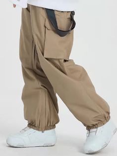 It's impossible to beat these jeans ski pants' bagginess and steezy colorways. Styled to make every fit look amazing, they’re guaranteed to be your favorite winter investment. Designed with 2 front zipper pockets, 2 back pockets, 2 cargo pockets, snow-repelling elastic cuffs and leg vents, there's no way you won’t enjoy your day in these baggy snow pants. Features Include: Waterproofing: 15K Waterproof / 10K Breathable Fabric: Polyester, OMINI-HEAT tech applied to save more heat. Fit: Baggy Insu Baggy Hip Hop Cargo Jeans For Outdoor, Hip Hop Style Baggy Cargo Jeans For Outdoor, Casual Cargo Jeans For Fall Outdoor Activities, Fall Outdoor Cargo Jeans In Casual Style, Trendy Winter Bottoms With Pockets, Trendy Full Length Cargo Pants For Winter, Winter Casual Full-length Cargo Jeans, Winter Casual Full Length Cargo Jeans, Khaki Full Length Bottoms For Streetwear