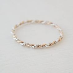 Handmade sterling silver twisted with gold filled ring. Band measures 1.5mm thick. Minimalist Twisted Jewelry For Anniversary, Yellow Gold Twisted Stackable Jewelry, Gold Twisted Stackable Jewelry, Dainty Twisted Yellow Gold Jewelry, Twisted 14k Gold Jewelry For Anniversary, 14k Gold Twisted Jewelry For Anniversary, Twisted Silver Jewelry For Everyday, Everyday Silver Twisted Jewelry, Twisted White Gold Jewelry Gift