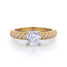 a yellow gold engagement ring with an oval cut diamond in the center and two rows of diamonds on each band