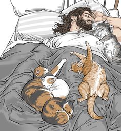 a man laying in bed with two cats and a cat sleeping on his back next to him