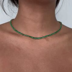 Beautiful Diamond Tennis Necklace. A staple in your jewelry collection. Handmade in New York City of polished 14k white gold. This tennis necklace showcases a delicate 4 prongs in line chain embellished with dozens of shimmering ( NO Lab Made) Emeralds . Quality to us is important and that is why we hand select our diamonds for premium quality. - 19.00 ct. t. w. Emeralds - 19.61 gr 14k Gold Weight Emerald Tennis Necklace, Emerald Green Jewelry Necklaces, Green Jewelry Necklace, Emerald Green Jewelry, Green Dinnerware, Emerald Green Necklace, Prom Necklaces, Diamond Tennis Necklace, Green Jewelry