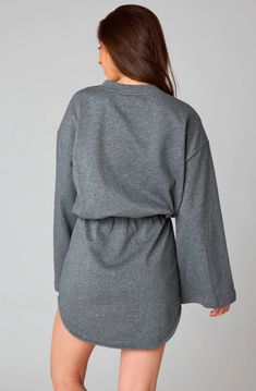 Buddy Love: Willa Sweatshirt Dress - Heather Grey A sweatshirt dress is exactly what we've had our eye on! The Willa dress is a complete mix of comfy and cute all in one. This sweatshirt material dress is featured with an elastic waist, a body-con mini skirt, and a loose fitting top silhouette. The bell sleeves are the star of the show and adds just the right amount of flair to this look. Pair this sweatshirt dress with sneakers for the most adorable fit. heather grey sweatshirt dress bust: rela Oversized Cotton Sweatshirt Dress, Crew Neck Sweatshirt For Daywear In Fall, Fall Crew Neck Sweatshirt For Daywear, Oversized Cotton Sweatshirt Dress For Spring, Cotton Long Sleeve Dresses For Layering, Crew Neck Cotton Lounge Dresses, Oversized Gray Fall Dress, Casual Spring Sweater Dress With Ribbed Cuffs, Cozy Fit Heather Grey Sweatshirt For Loungewear