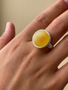 This unique ring is a special piece from Strelnik Jewelry. Made with care, it features high-quality sterling silver. At the center, you'll find a beautiful piece of natural Baltic amber, known for its stunning colors and natural beauty. This ring is more than just jewelry; it's a standout accessory that adds something special to any outfit. Strelnik Jewelry prides itself on creating unique, easy-to-love pieces that make you stand out.The jewelry is presented in a unique piece. Amber Ring, Ring Collection, Large Ring, Unique Ring, Amber Jewelry, Easy To Love, Baltic Amber, Ring Collections, Sterling Ring