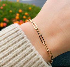 Lend interest to your attire with this Paperclip Chain Bracelet. Crafted in 14K Gold, this 7.25 inch length bracelet of the hollow oval-link chain is a great anytime choice. Buffed to a brilliant luster, this bracelet secures with a lobster clasp. Wear it every day - whenever, wherever. Metal: 14K Gold (Stamped) Closure of Bracelet: Lobster Clasp Bracelet Length: 7.25 inches Paper Clip Bracelet Gold, Yellow Gold Rectangular Paperclip Bracelet, Elegant Hypoallergenic Paperclip Bracelet, Bangle Collection, Miraculous Medal Necklace, Hand Jewelry Rings, Bridal Diamond Necklace, Paperclip Bracelet, Anklet Designs