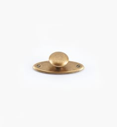 an antique brass plated metal object on a white background