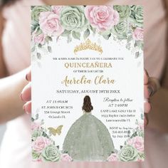 a woman holding up a card that says quinceauera on it with flowers