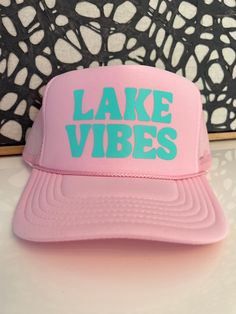 Lake Vibes Pink Trucker hat with blue font. Adjustable back strap and french terry head band. Lake Trucker Hat, Lake Shirts, Lake Vibes, Pink Trucker Hat, Trending Hats, Blue Font, Pink Lake, Yellow Glitter, Hanging With Friends