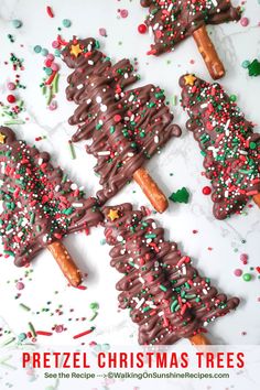 chocolate pretzel christmas trees with sprinkles on them