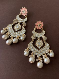 Beautiful Gold Kundan ChandBali Earrings with floral motif  embellished in three different colours. Ready to make a style statement this wedding season? Three colours available - Peach, baby pink and pastel grey/white Festive Pearl Drop Bridal Earrings For Reception, Bollywood Style White Bridal Earrings For Reception, Festive Bridal Earrings With Pearl Drop For Reception, Festive Bridal Pearl Drop Earrings For Reception, Elegant Wedding Danglers With Gota Work, Festive Bridal Earrings With Meenakari For Reception, Gota Work Bridal Earrings For Reception And Festivals, White Meenakari Bridal Earrings For Wedding, White Meenakari Bridal Earrings