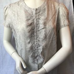 Ann Taylor Loft Sheer Ruffled Blouse (12 Petite) Gray Sheer Blouse With Ruffles And Lace. Cap Sleeves With Lace Detail Pit To Pit 20” Length 25” 100% Cotton Machine Washable Never Worn- In Excellent Condition (No Tears, Rips, Pulls Or Stains) Feminine Short Sleeve Blouse With Ruffles, Elegant Summer Shirt With Ruffles, Elegant Ruffled Shirt For Summer, Elegant Ruffled Summer Shirt, Fitted Short Sleeve Shirt With Ruffles, Fitted Tops With Ruffle Sleeve For Daywear, Summer Ruffled Button-up Blouse, Fitted Short Sleeve Blouse With Ruffles, Feminine Short Sleeve Shirt With Ruffles