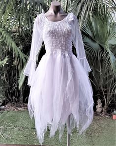 Make your occasion extra-special with one of our magical dresses.  *This beautiful fairy dress is made from high quality polyester body with three layers of soft tulle. *The dress has a stretch bodice to fit all sizes from 1XL up to 4XL. *Available in a large range of colours to choose from to suit your theme - from delicate pastels to deeper rich shades. *To add extra sparkle to the dress, it has scattered sequins sewn over the dress and beads at the hems.   A MATCHING GARLAND CAN BE PURCHASED Spring Fairy Dress For Costume Party, White Fairycore Costume Dress, White Fairy Kei Dress With Ruffles, White Fitted Fairycore Dress, White Fairy Kei Dress For Spring, Fairytale Tulle Costume Dress, Fitted White Fairy Kei Dress, White Fairytale Dress For Costume Party, Fairy Style Dress-up Tulle Dress