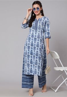 Readymade Pure Cotton Straight Kurta in Blue This Notched Round Neck and Quarter Sleeves attire is Enhanced with Floral Print Available with a Pure Cotton Palazzo in Blue Do Note: Accessories shown in the image are for presentation purposes only and length may vary upto 2 inches.(Slight variation in actual color vs. image is possible). Chudithar Designs, Straight Kurti Designs, Diwali Wear, Top Fabrics, Lucknowi Kurti, Motifs Embroidery, Elegant Prints, Indian Suits For Women, Pakistan Clothes