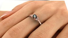 black Pearl Engagement Ring, Pearl Wedding Ring, 14k gold pearl ring, diamond pearl ring, black tahitian pearl rings, Black Pearl Ring black Freshwater Pearl engagement ring with lovely diamonds, set in 14k solid gold. ► FEATURES; Gemstones: Freshwater Pearl: 4- 5mm , Diamond: 4*1mm Total diamond carat weight: 0.03 (Color H; clarity VS) Material options: 14k rose gold, 14k yellow gold, 14k white gold Size: all ring sizes are available How to Order: Please select your preferred size and material Black Pearl Ring Engagement, Black Pearl Wedding Ring, Mangalsutra Ring, Black Pearl Engagement Ring, Pearl Wedding Ring Set, Engagement Ring Pearl, Diamond Pearl Ring, Black Pearl Ring, Tahitian Pearl Ring