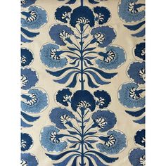 a blue and white wallpaper with large flower designs on it's back side