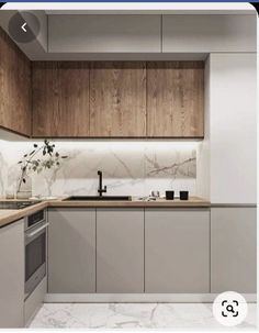 an image of a kitchen setting with marble countertops and wood paneling on the walls