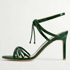 Elevate your style with these chic green crocodile embossed lace-up sandals. Featuring a strappy design and stiletto heel, these sandals exude sophistication and bold fashion-forward allure. Color: Green Heel Type: Stiletto heel Heel Height: 4.13'' / 105 mm approx Product measurements were taken using size 8. Please note that measurements may vary by size. Toe: Open toe Crocodile embossed design Strappy design Lace-up design Handcrafted US sizing. Fits true to size. Luxury Lace-up Sandals For Spring, Green Lace-up Sandals With Wrapped Heel, Chic Green High Heel Lace-up Sandals, Green Strappy Leather Heels, Green Leather Strappy Heels, Green Strappy Heels For Formal Occasions, Luxury Lace-up Summer Sandals, Luxury Summer Lace-up Sandals, Luxury Lace-up Sandals For Summer