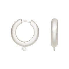 a pair of small silver hoop earrings on a white background with clippings to the side