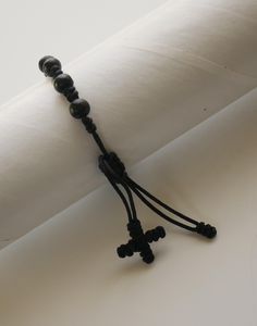 THIS BRACELET IS TO BE USED BY MEN or WOMEN. ADJUSTS FROM 7" - 9.5" This listing is for (1) Bracelet. BEADS: Beads have are made of wood and are round in shape. They measure approx. 1/4" in diameter. Beads are connected to the others with a cord. This is a very good quality and elegant rosary bracelet that you can use anytime of the day. Come Visit Us at Our New Store! Please feel free to email me with questions about this item. Also please check my other listings. I am always available to answer your questions promptly. Buy from us with confidence. Handmade Black Spiritual Leather Bracelet, Adjustable Black Leather Bracelet With Round Beads, Adjustable Black Wristband With 8mm Beads, Adjustable Black Beaded Rosary Bracelet, Adjustable Black Spiritual Bracelet, Adjustable Handmade Black Rosary Bracelet, Adjustable Beaded Cross Bracelet, Adjustable Cross-shaped Beaded Bracelets, Adjustable Black Cross Jewelry