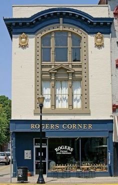 the corner of a street in front of a building