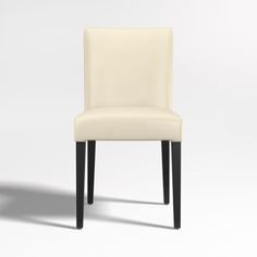 a white chair sitting on top of a white floor