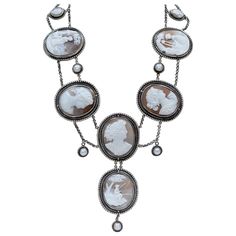 This divine legacy necklace designed in the Elizabethan style features a suite of six very fine antique nineteenth century shell Cameos. Created in Italy as a set for a wealthy patron - each of the large cameos measures 1.88 x 1.50. Four of the six Cameos depict Romanesque Goddesses. At the top of this necklace are two additional hand carved Goddess cameos - original to the suite, measuring approximately 11 x 14 mm. Double chaining joins each exquisite cameo, with 8-9 mm freshwater pearl "button Etruscan Jewelry, Pearl And Diamond Necklace, Diamond Tiara, Cameo Jewelry, Victorian Gold, Carved Shell, Gold Engraving, Cameo Brooch, Cameo Pendant