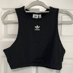 Nwt Adidas Tank Top. Black Ribbed Tank Top With White Embroidered Adidas Emblem On Front. Size Large. Small Cutout On Bottom. So Cute For Gym Or Every Day ! Brand New With All Tags Attached. Slightly Cropped Style Adidas Sporty Cotton Tank Top, Adidas Trendy Fitted Tops, Trendy Fitted Adidas Tops, Adidas Fitted Tops For Streetwear, Adidas Fitted Streetwear Tops, Fitted Adidas Tops For Streetwear, Adidas Fitted Summer Tops, Adidas Cotton Tank Top For Spring, Adidas Casual Cotton Tank Top