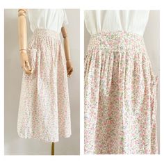 "Cute 70s Cacharel midiskirt Made from a cotton liberty printed floral fabric Closes at the back with a zipper The skirt has pocket at the side UK Size: 6-8 (xs-s), US: 4-6, EU: 34-36 Waist: 33,5 cm - 13,2\" Length: 72 cm - 28,4 \" Material: 100% cotton In perfect condition This item has been washed and steamed so that there are no more odors. This item is vintage, which means 25 years or older. Small flaws are not uncommon, but we do our best to mention them in the description Return Policy: It Feminine Cotton Floral Print Skirt, Spring Cotton Peasant Skirt, Peasant Cotton Skirt For Spring, Cotton Peasant Skirt For Spring, Cotton Floral Print Skirt For Garden Party, Bohemian Cotton Skirt For Garden Party, Vintage Cotton Floral Print Skirt, Vintage Cotton Skirt With Floral Print, Cottagecore Cotton Skirt For Summer