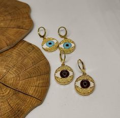 hoop earringsgold hoop earringsdangle earringshuggie hoop earringsclip on earringsgold evil eyeevil eye earringsgold earringsdrop earringsgift for hervintage earringsstatement earringseye earringsGold evil eye hoop earringsThis cute earrings are made from steell and they are 24k gold plated and handpainted.You can choose between 4 different clasps (the numbers 1 and 2 are for non pierced ears)They are very light and comfortable!Plus they are anti allergic/ nickel free ❤Evil eye meaningThe evil e Gold Evil Eye Drop Earrings, Adjustable Gold Evil Eye Earrings, Gold Evil Eye Earrings As Gift, Elegant Evil Eye Earrings As A Gift, Sterling Silver Evil Eye Dangle Earrings, Elegant Evil Eye Earrings For Gift, Brass Evil Eye Jewelry For Gifts, Gold Plated Evil Eye Jewelry, Evil Eye Brass Jewelry As A Gift