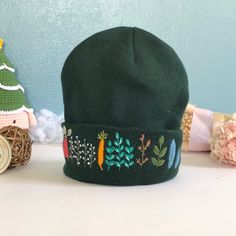 "The embroidered beanie hat is handmade one stitch at a time on the hat. It is embroidered only on the front. 🧶 Measurement: approximate 7\"-8\" in length. 🧶 Washable alone with the laundry bag, gentle or dedicated cycle. 🧶 DO NOT DRY by DRYER; HANG DRY ONLY! 🌸 Thanks for visiting my little shop, located in Pittsburgh, PA! Please do not hesitate to contact me if I could further assist/information on this item." Embroidered Winter Hats, Adjustable Cotton Beanie For Winter, One Size Cotton Beanie Bonnet, Winter Cotton Bonnet Cap, Cotton Winter Bonnet, Green Brimmed Beanie (one Size Fits Most), Green Brimmed Beanie, One Size Fits Most, Cotton Beanie With Embroidered Logo, Adjustable Cotton Winter Hat